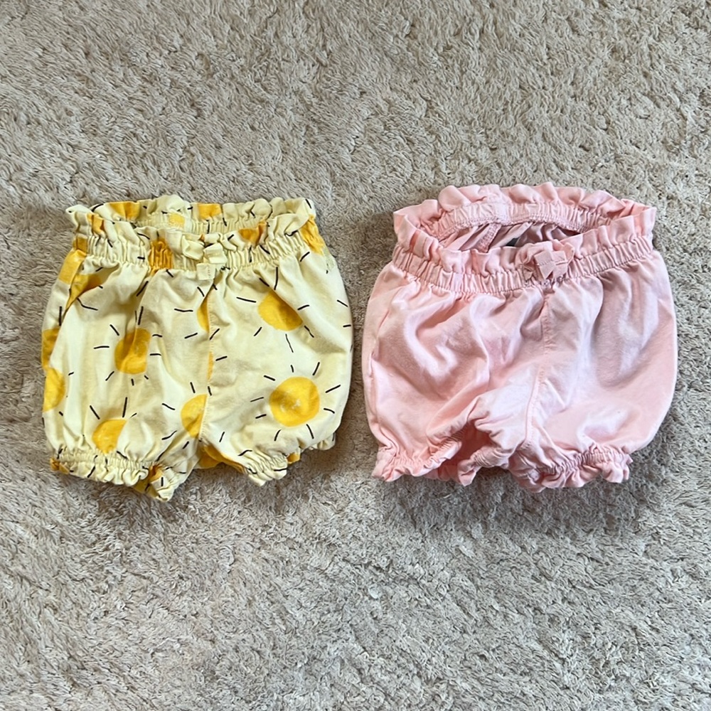 2 Baby Gap stretchy shorts, pink and sun print. Size 3-6M